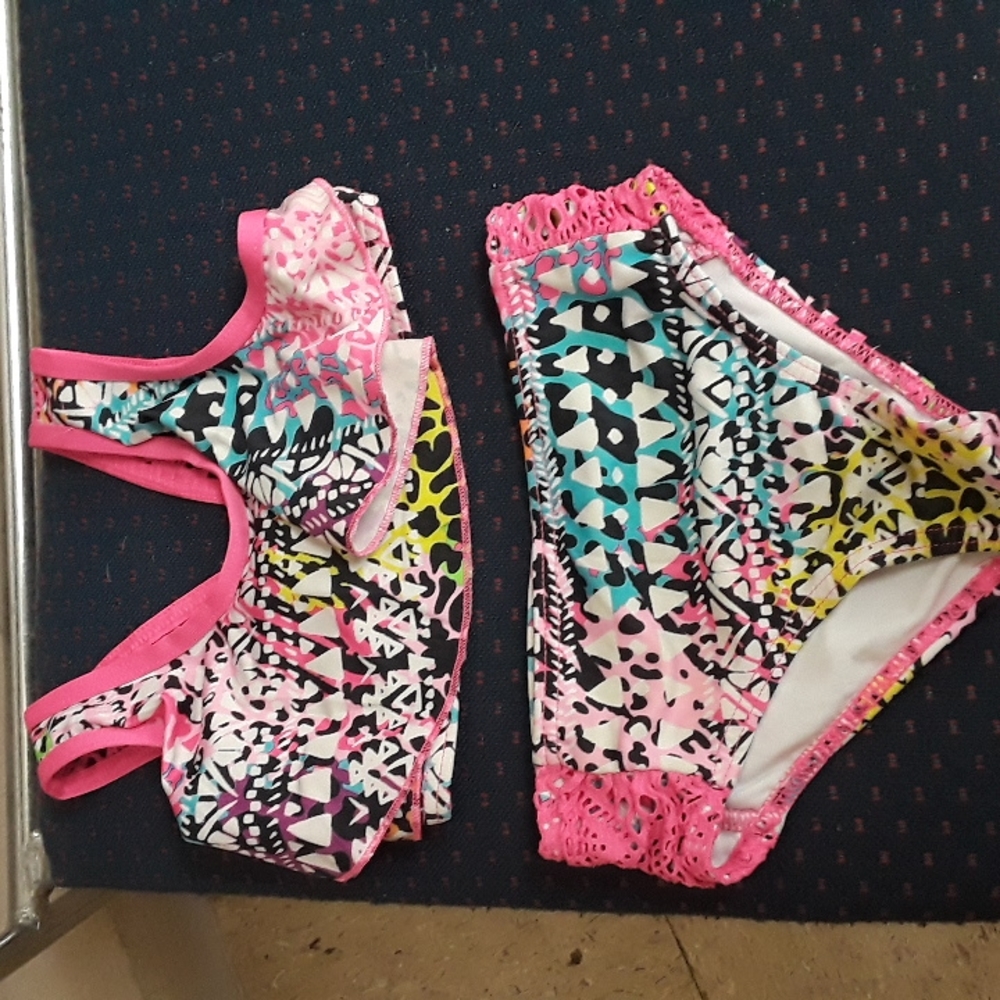 Set if 3 bathing suits and a pair of water shoes